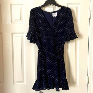 Navy blue polka dot dress with ruffle sleeve